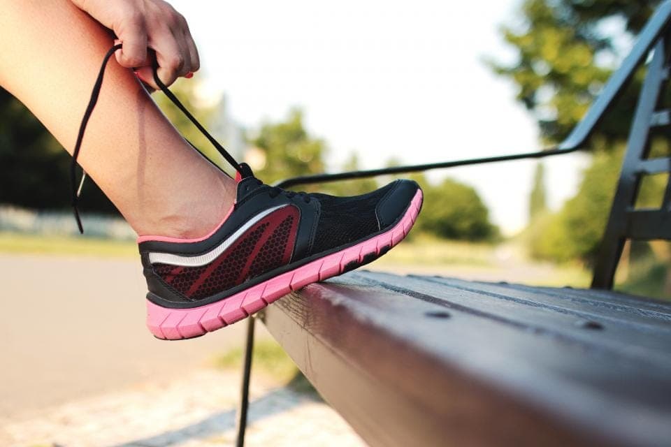 A cushioned trainer and a thin minimalist shoe side by side