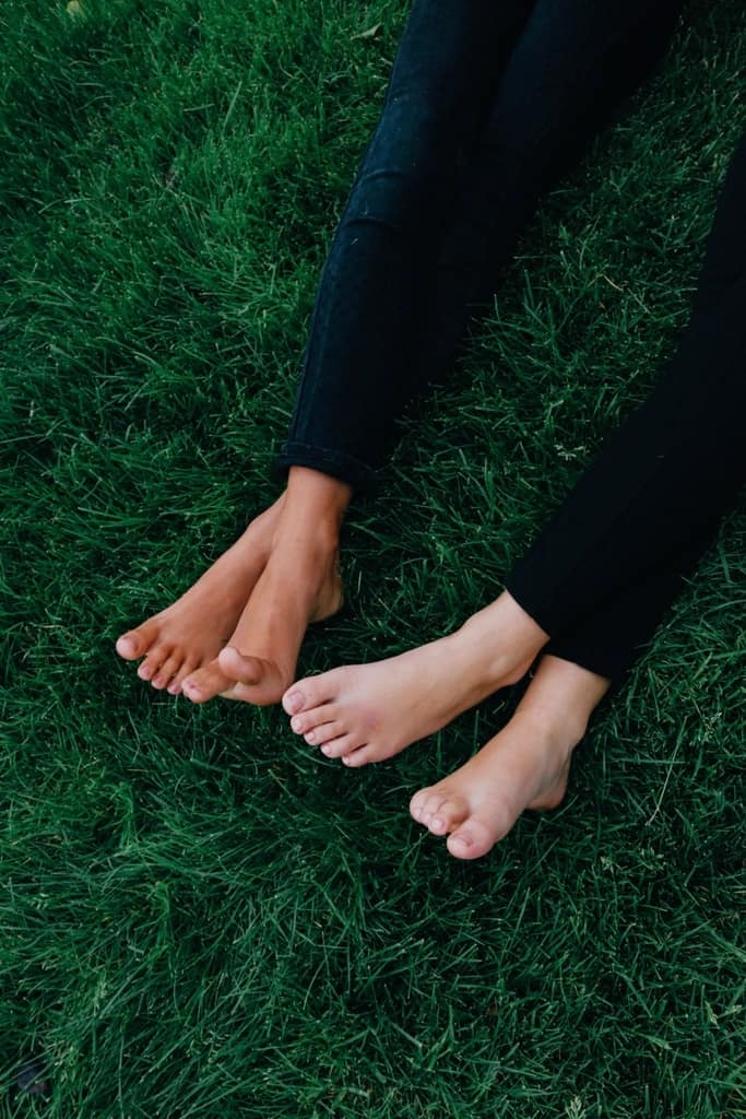 A person walking on a path in thin-soled shoes