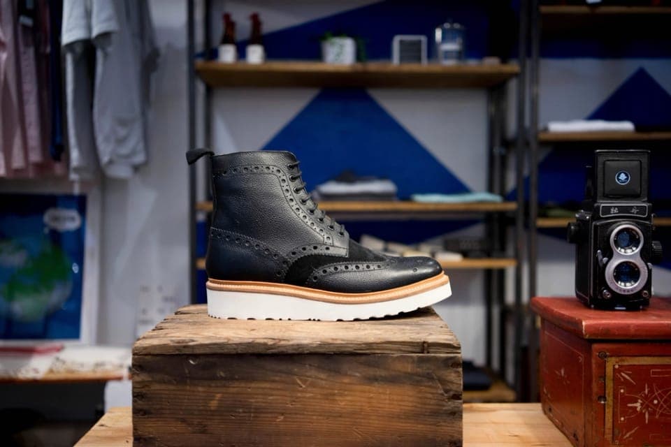 Two work boots side by side on a workshop surface