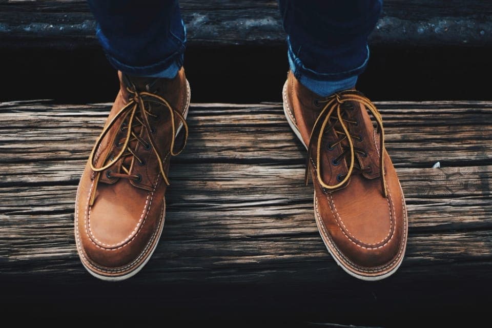 An insulated wide-toe-box boot on frosted ground