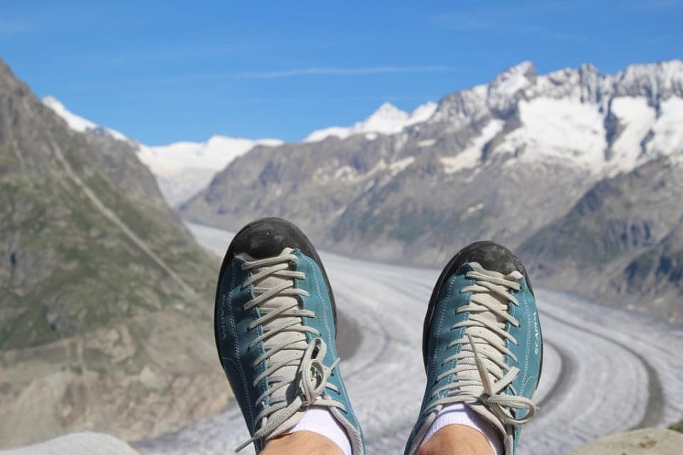 A low-profile trail shoe with shallow lugs on a dirt trail
