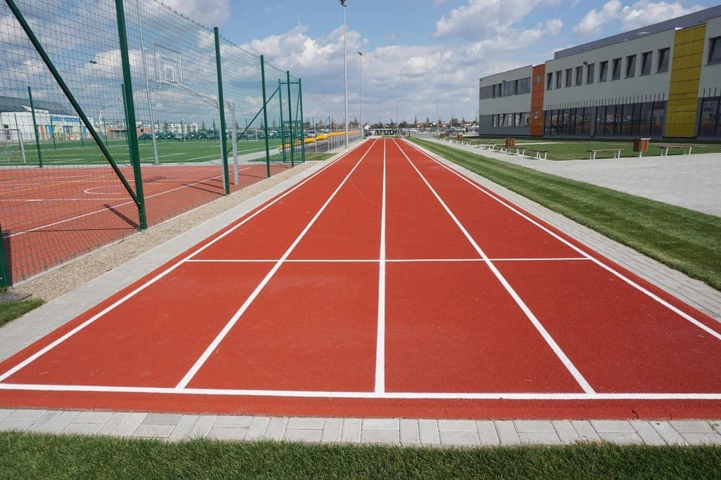 A cushioned zero-drop running shoe photographed from the side